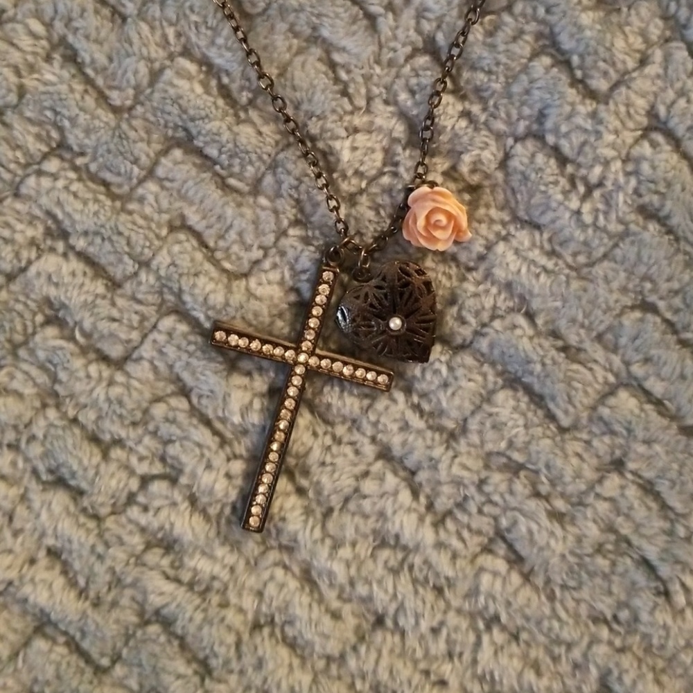 Gunmetal gray cross and flower locket